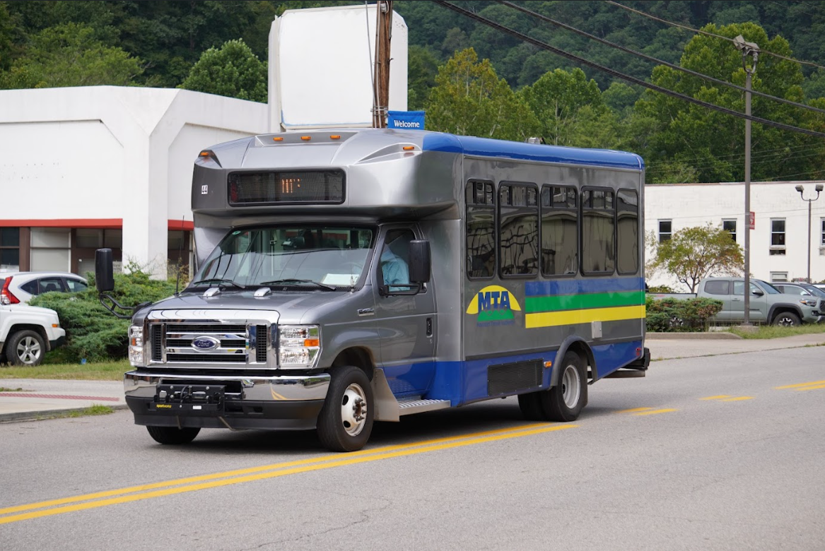 Mountain Transit Authority bus driving down a street